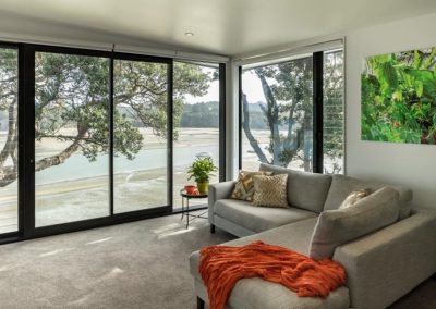 New Home Maximises Views Over Bay with Generous Forms of Glazing