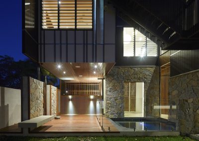 Exterior of home at night with Breezway Louvres
